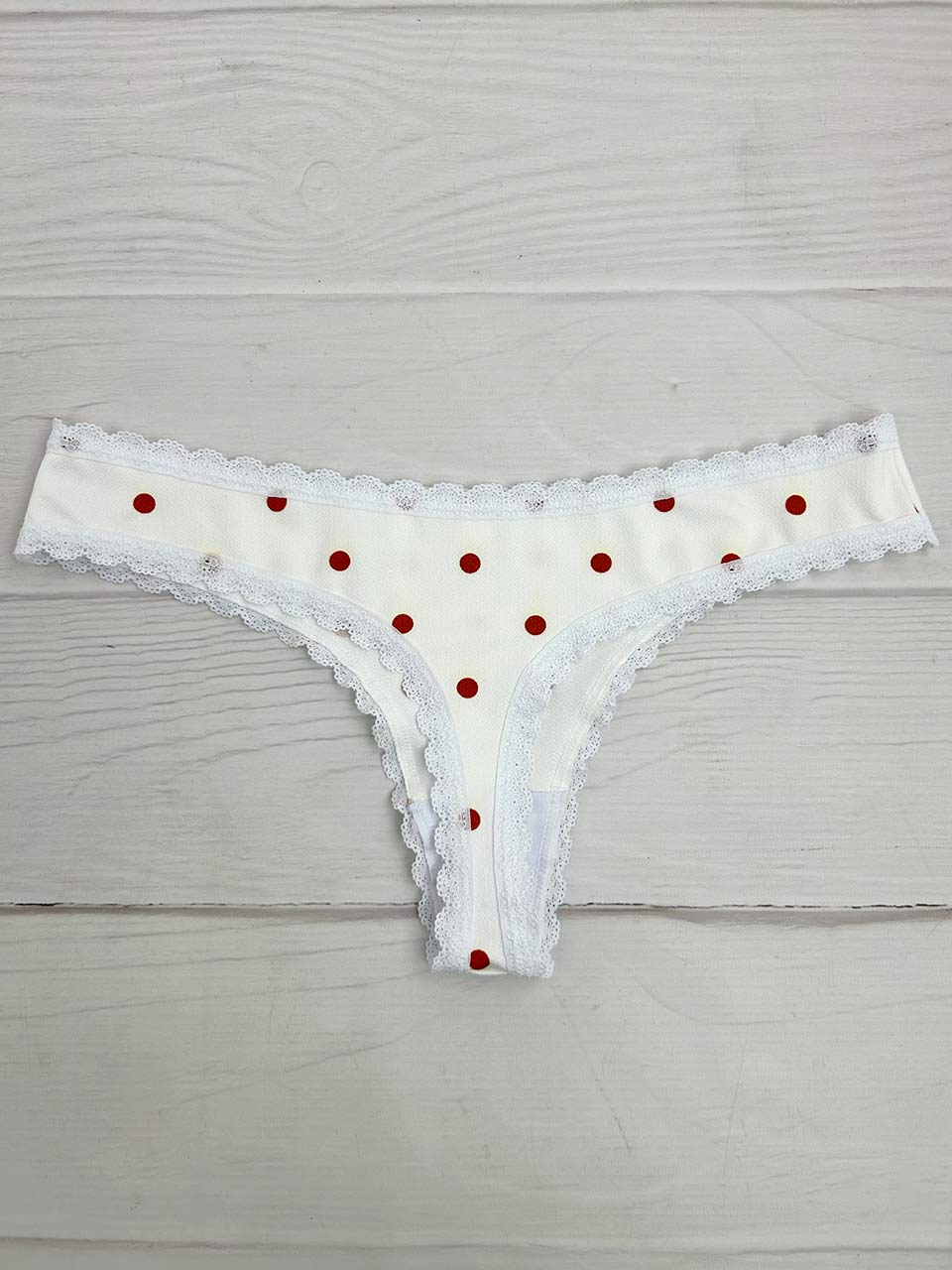 Tanga lisa marfil puntos naranja