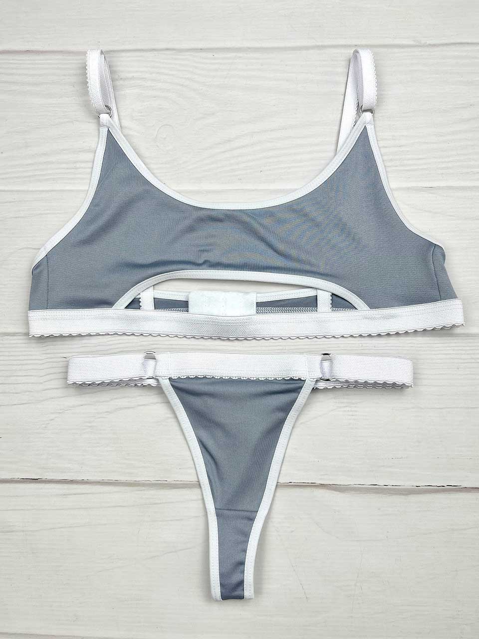 Conjunto deportivo gris con blanco