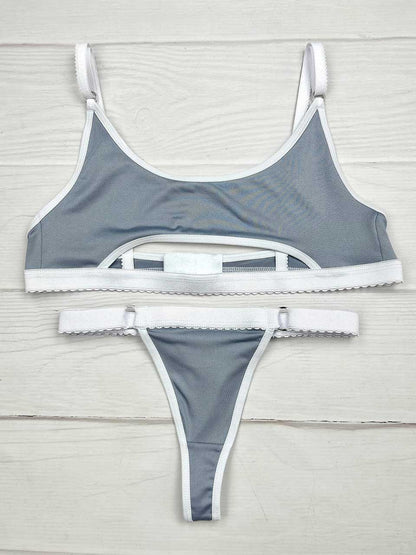Conjunto deportivo gris con blanco