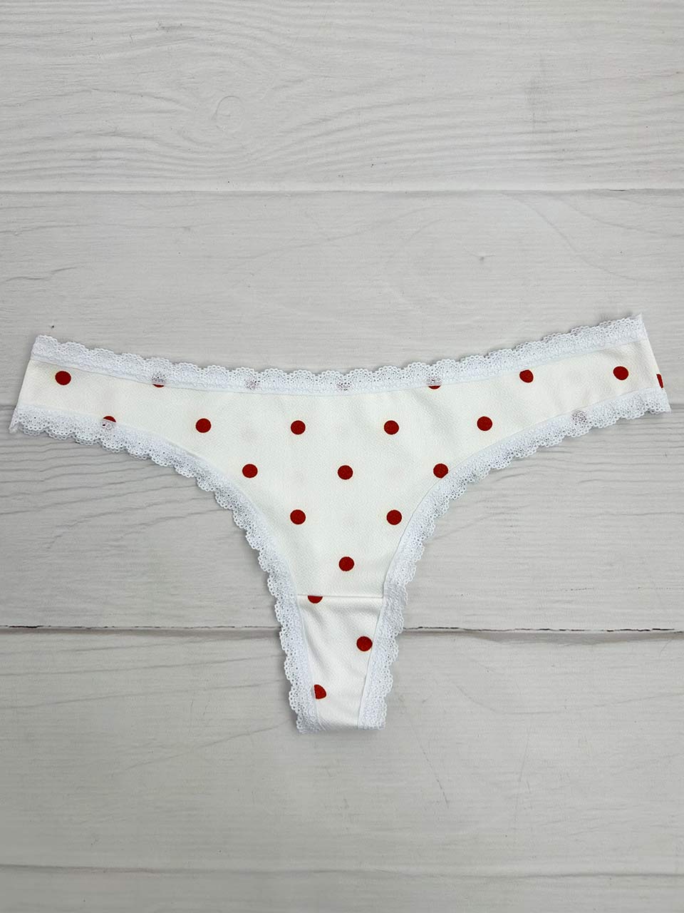 Tanga lisa marfil puntos naranja